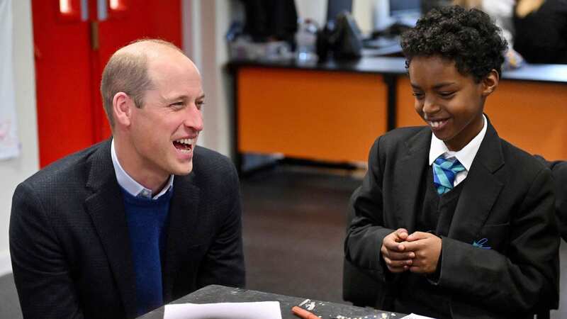 Prince William laughs after he