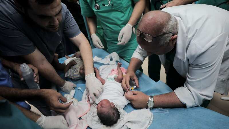 Doctors treating a wounded baby at the Al-Aqsa hospital in Deir Al-Balah (Image: Adel Al Hwajre/IMAGESLIVE via ZUMA Press Wire/REX/Shutterstock)