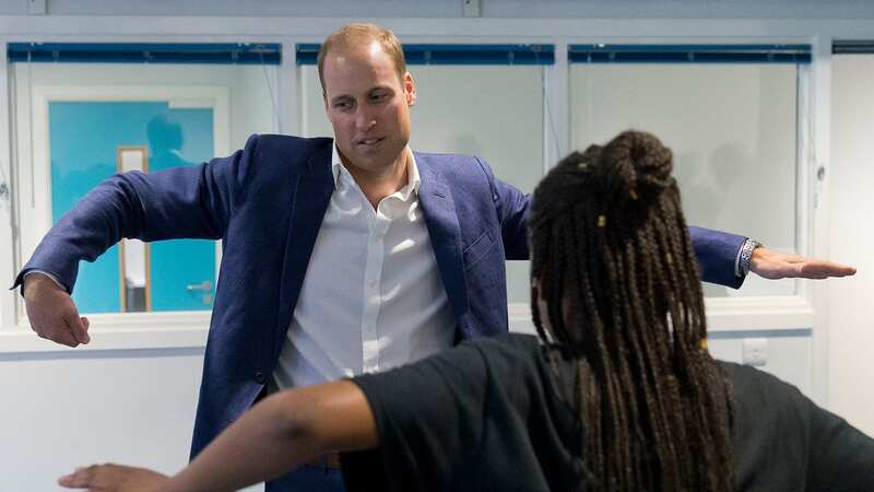The Duke of Cambridge learns a dance move with Scariofunk dance collective during a visit to Caius House youth centre (Image: PA)