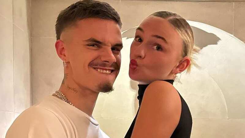 Romeo Beckham grabs girlfriend