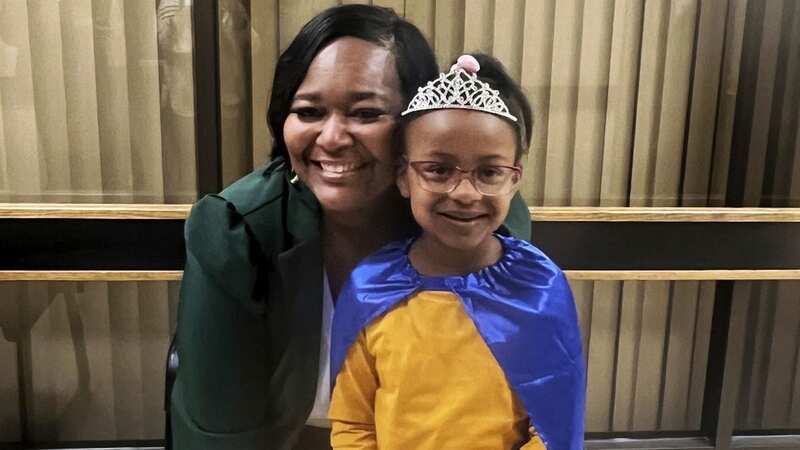 Bryanna Cook with Latonya Malone, the 911 dispatcher who took the girl