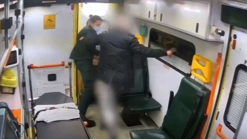 Horrifying moment patient pushes paramedic out of ambulance after weeing inside
