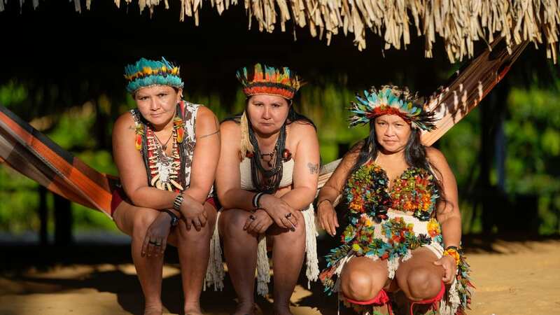 Mandei Juma (right) is leading the tribe to safety (Image: AP)
