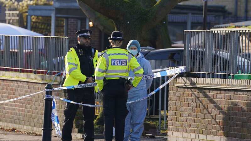 Police officers pictured at the scene of the shooting in east London (Image: PA)