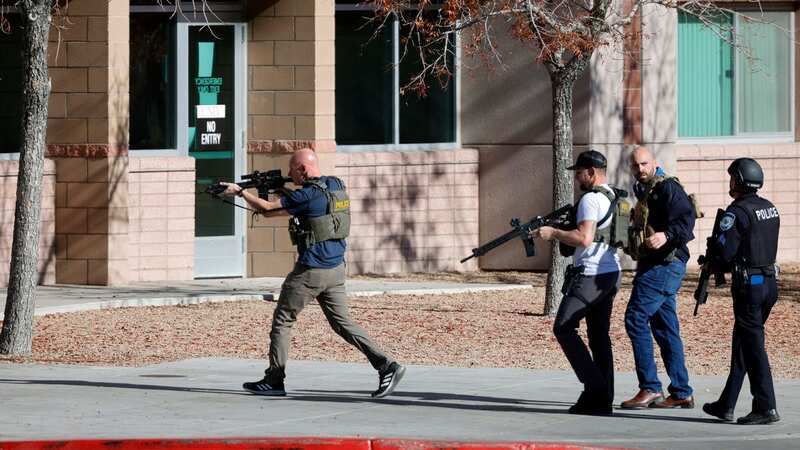 Law enforcement officers head into the University of Nevada, Las Vegas, campus after reports of an active shooter (Image: AP)