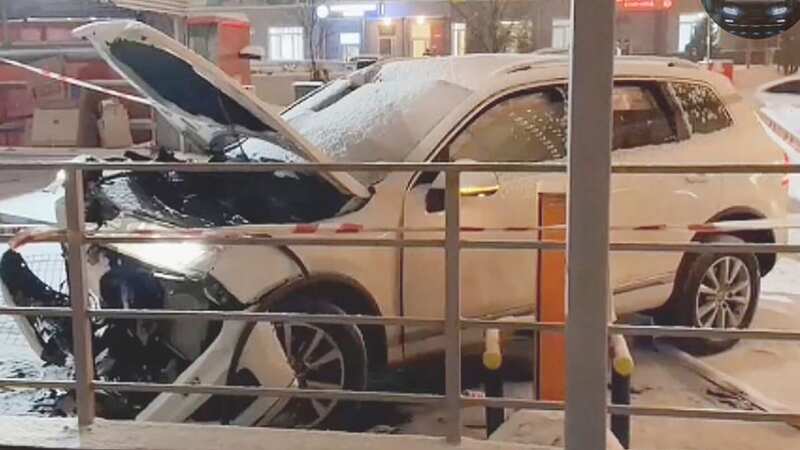 Man cheats death as car plunges 40ft after smashing through car park barrier
