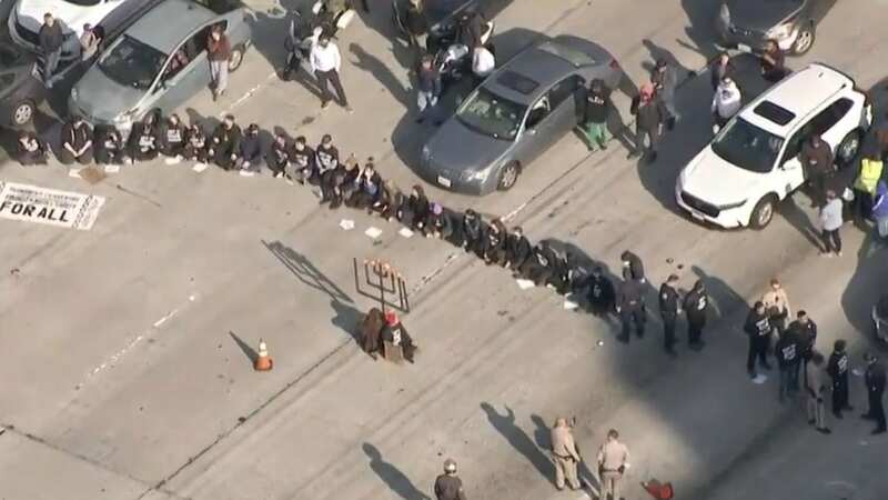 Dozens of protesters calling for a cease-fire in Gaza amid the Israel-Hamas war halted traffic on the 110 Freeway (Image: KTLA 5)