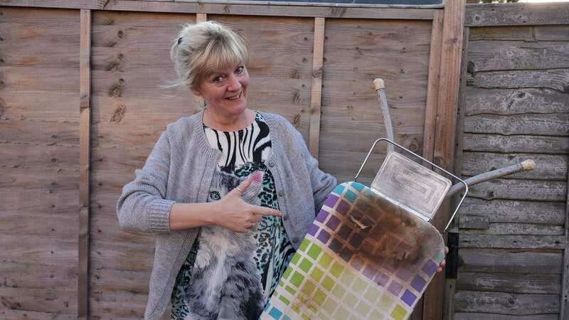 Karen Schmit poses with the ironing board with Margaret Thatcher