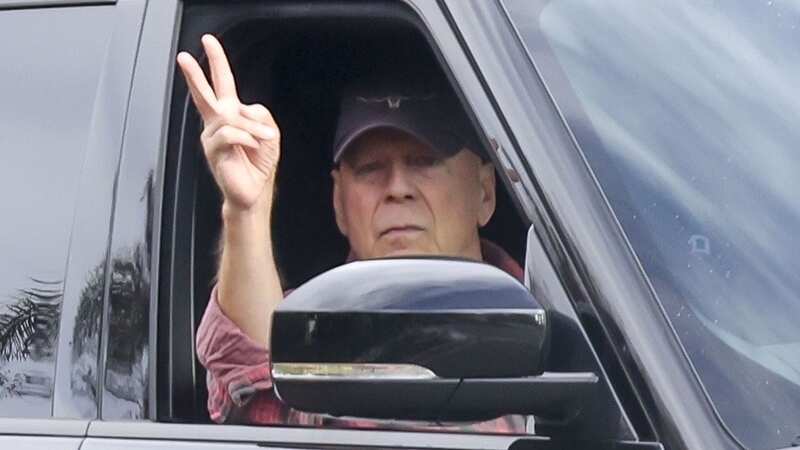 Bruce Willis flashes peace sign as family support star amid dementia diagnosis