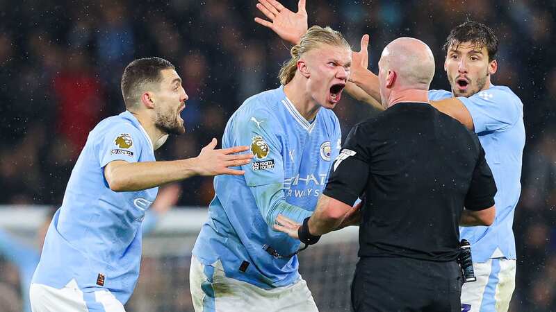 Manchester City have been charged for surrounding referee Simon Hooper against Tottenham (Image: Getty Images)