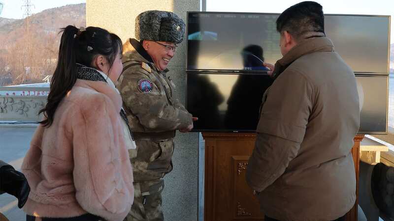 North Korean dictator Kim Jong-un pictured with his daughter at a test missile launch (Image: KCNA VIA KNS/AFP via Getty Image)