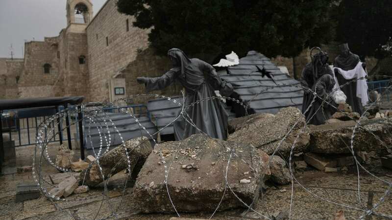 The nativity scene honours the victims of war rather than the birth of Jesus (Image: AP)