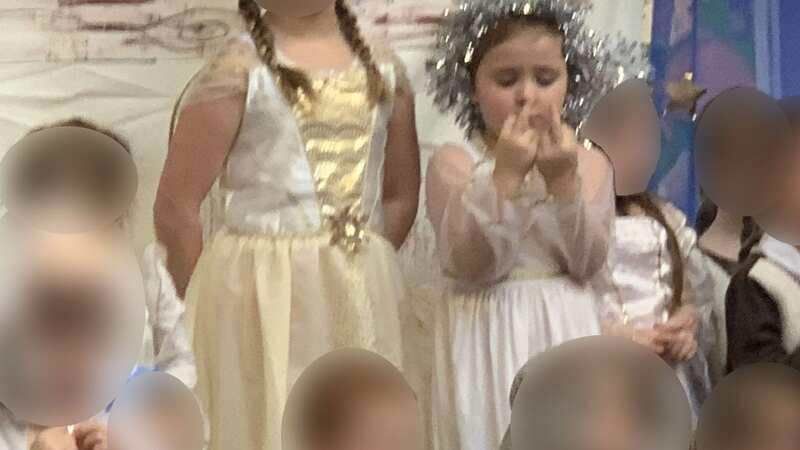 Five-year-old Ella stuck her middle finger up for the majority of her school performance (Image: Kennedy News)