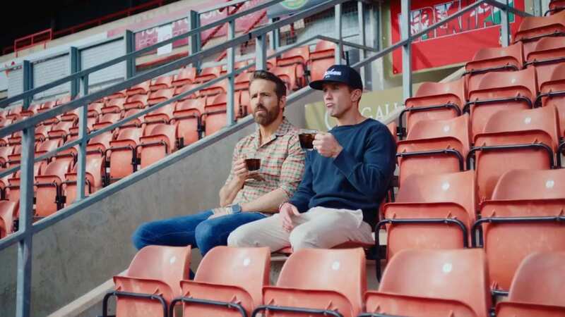 Wrexham Executive Director Humphrey Ker (middle) said the club lost some money when they built a temporary stand ahead of a new stand that will be built at the Racecourse Ground (Image: Matthew Ashton - AMA/Getty Images)