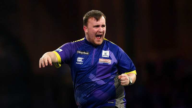 Luke Littler celebrates victory over Brendan Dolan (Image: PA)