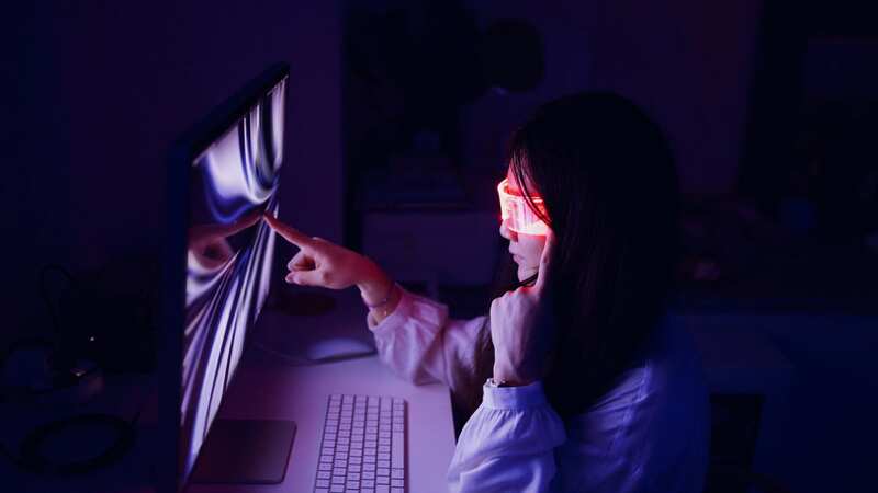 A woman plays a virtual reality game (file image) (Image: Getty Images)