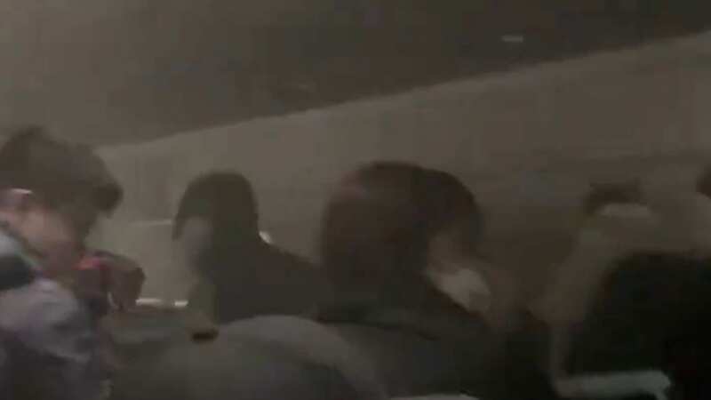 Inside burning Japan Airlines plane as terrified passengers fled for their lives
