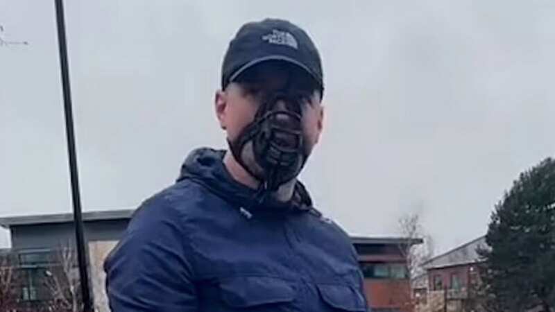 Aidan wore a black muzzle to match his dog