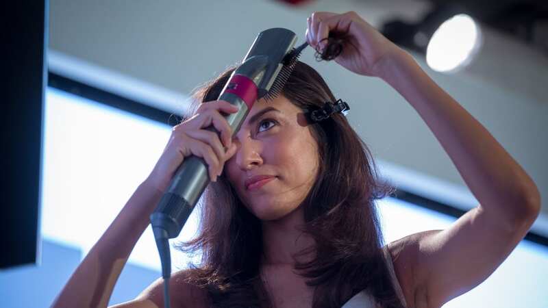 You could secure your own Dyson Airwrap for £100 less (Image: Getty)