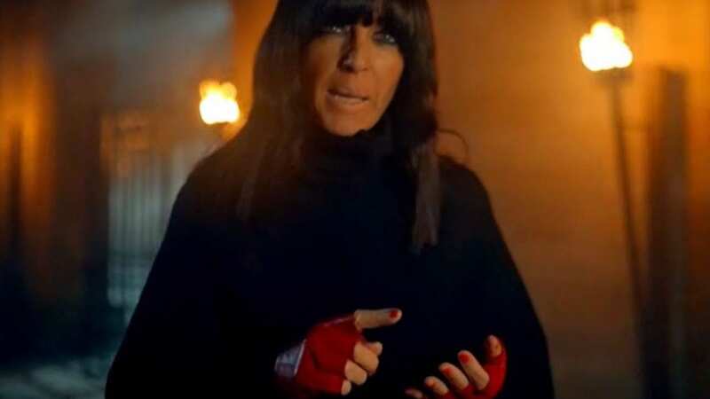 Claudia Winkleman in her iconic red fingerless gloves (Image: BBC)