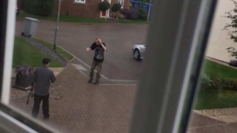 Moment warring neighbours coming to blows in row over gardening tools