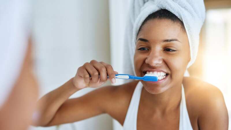 A dementia expert has revealed that struggling with simple daily tasks, like brushing your teeth, could be a sign of the disease (Image: Getty Images/iStockphoto)