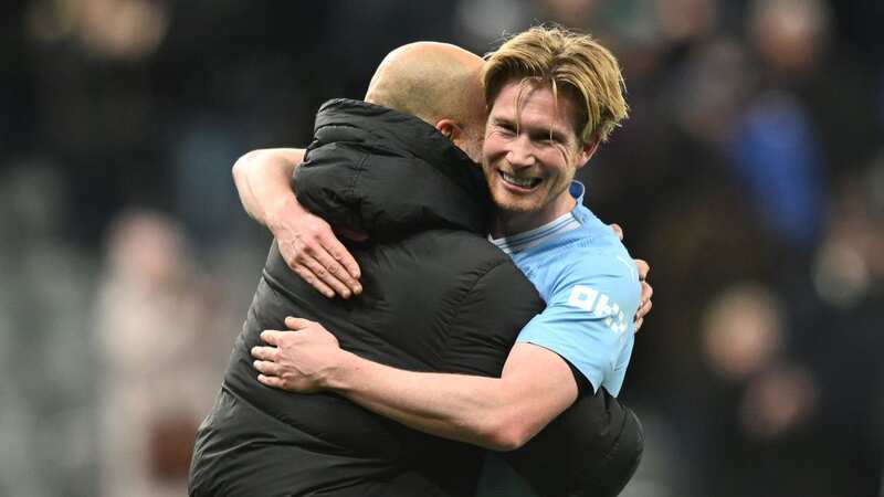 Kevin De Bruyne celebrates with Pep Guardiola after Man City