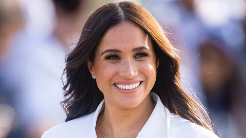 Meghan is sitting on 