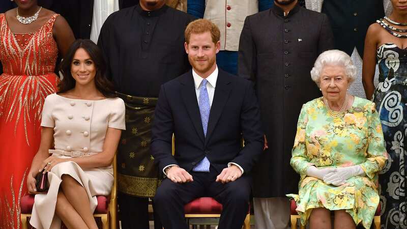 Harry and Meghan with the late Queen in 2018 (Image: Getty Images)
