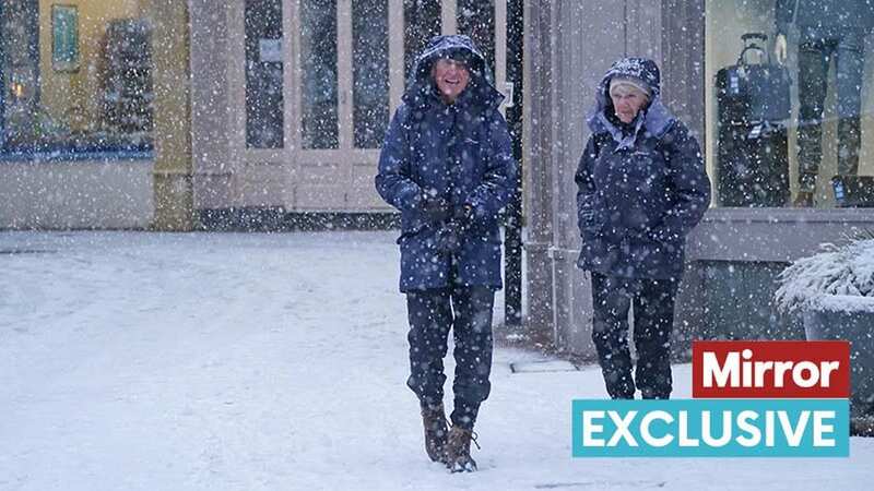 People walking in the snow in Keswick in Cumbria on January 16 (Image: PA)
