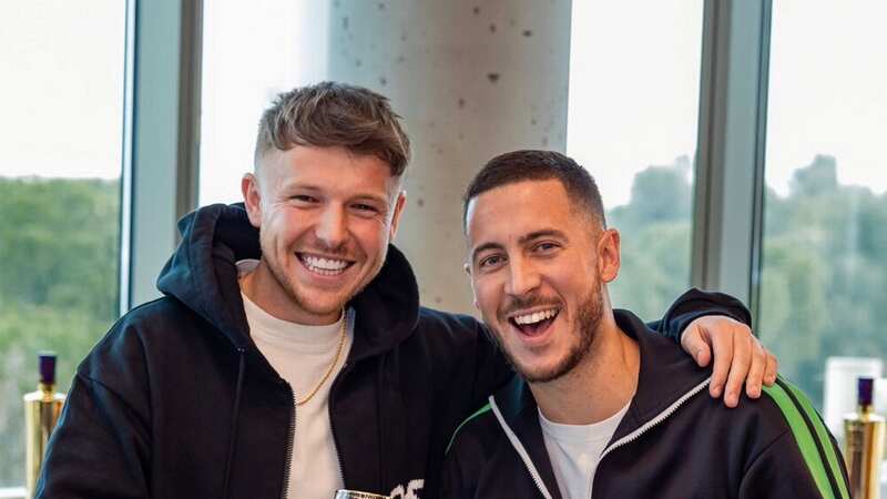 Eden Hazard post for a photo with the ball boy he once kicked