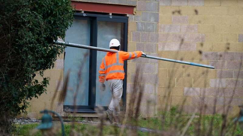 Workers from a scaffolding company put up poles at the home of Hannah Ingram-Moore (Image: PA)