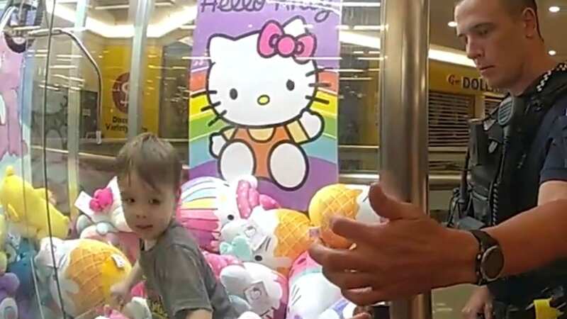 The toddler remained calm throughput the rescue (Image: Queensland Police /Twitter)