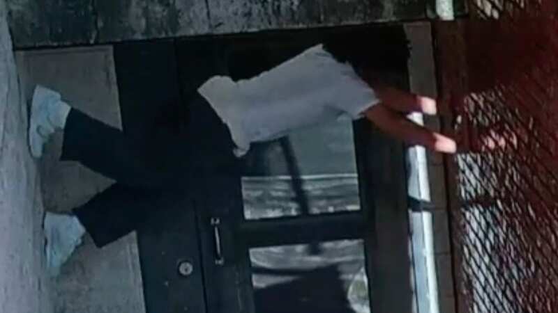 Moment prisoner makes brazen escape as murderer crab-walks up wall to flee jail