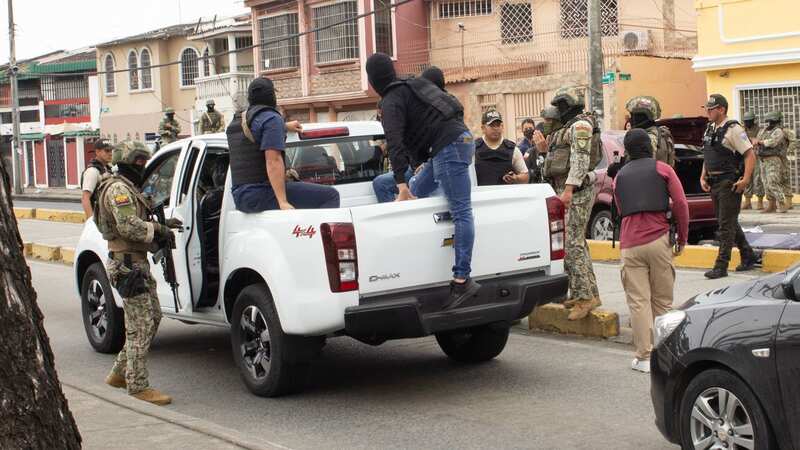 Police and military members stop an alleged criminal on the streets of Guayaquil on February 2, 2024 (Image: Getty Images)