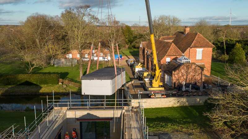 A spa pool is removed from the home of Hannah Ingram-Moore (Image: PA)