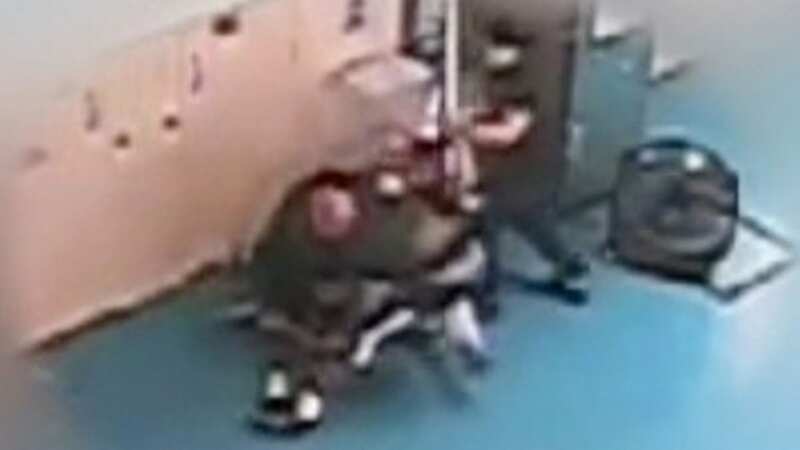 Teens caught on camera stamping on guard