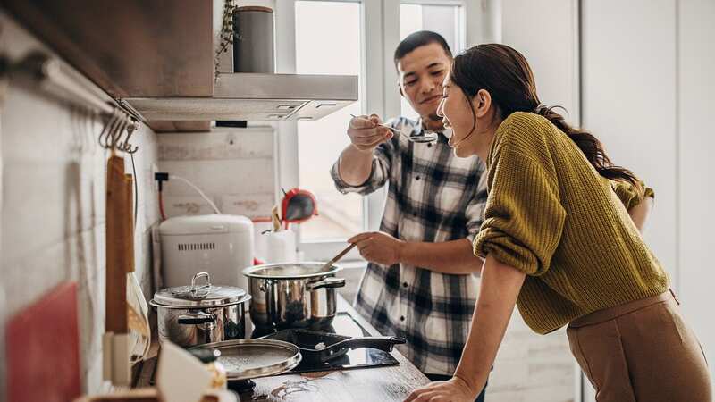 Someone cooking a meal for you is a top food turn-on, for over half of Brits (Image: South Agency/Getty Images)