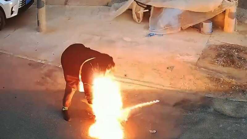 Moment Lunar New Year firecracker explodes in woman