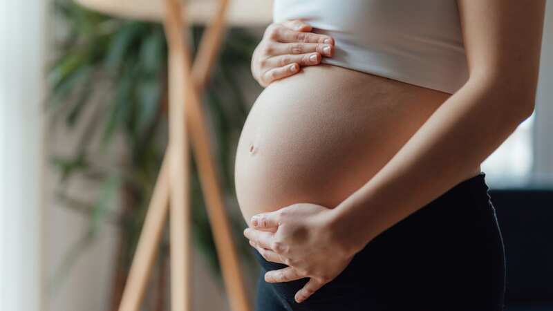 The woman can make her baby bump 