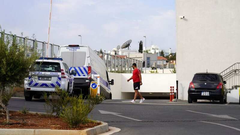 Cypriot police transporting the Israeli tourists to Famagusta district court in Paralimni (Image: AFP via Getty Images)