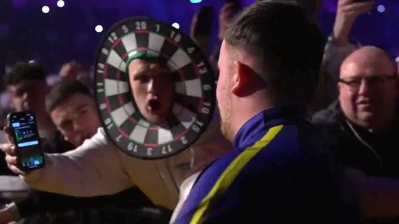 Luke Littler opened an Ultimate Team pack for a fan during his walk-on (Image: Sky Sports)