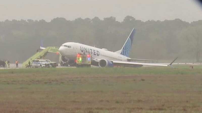 United Airlines passenger plane skids off Houston runway, tipping onto wing