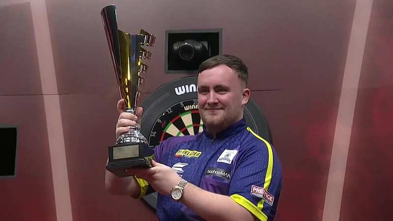 Luke Littler lifts the Belgian Darts Open trophy (Image: OfficialPDC/X)