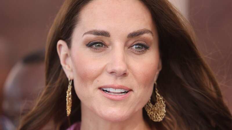 Kate Middleton has styled the trainers with both trousers and dresses (Image: PA)
