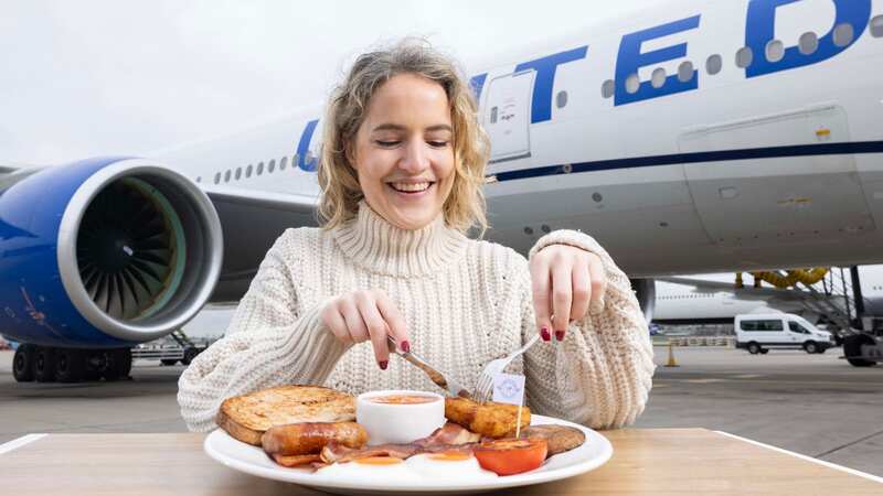 A diner eats a renewable biofuel English breakfast from Heston Blumenthal