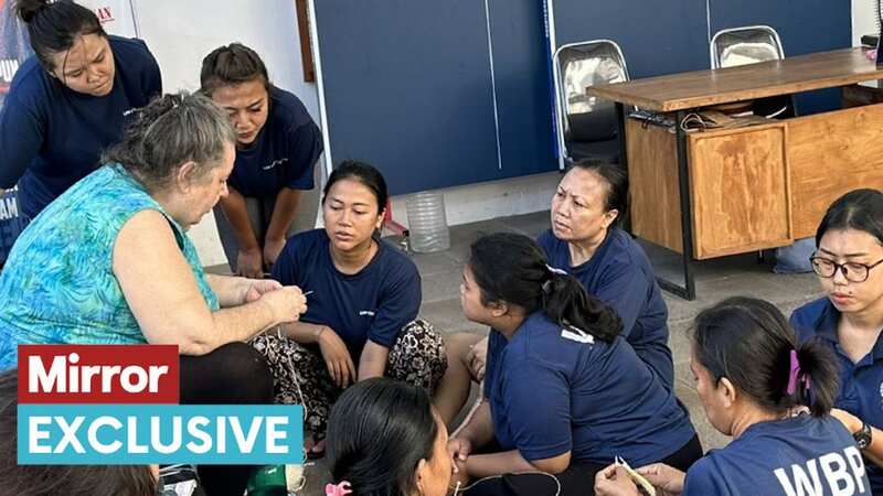 Lindsay Sandiford teaching other inmates how to use knitting needles (Image: Humphrey Nemar /daily mirror)