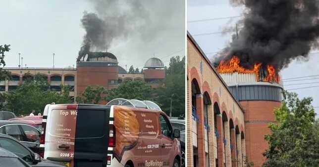 Shopping centre catches fire as huge plumes of smoke rise into the sky