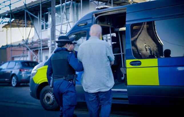 Rioters receive a shock as police carry out dawn raids across London
