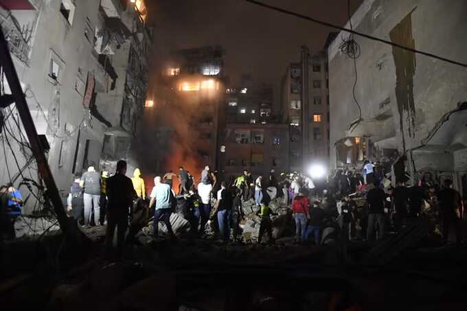 People conduct search and rescue works around the demolished apartment building aftermath of Israeli attack on the Nowayri neighbourhood of Beirut, the capital of Lebanon on 10 October 2024. Photograph: Anadolu/Getty Images